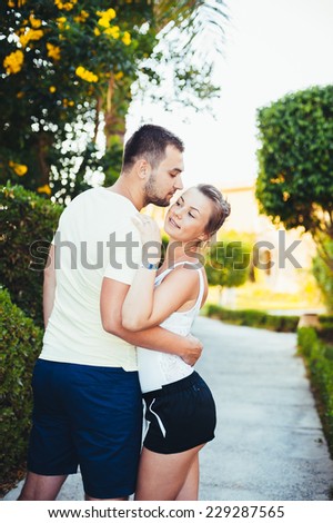 romantic couple during tropical vacation. Romantic Wedding Couple hugging on the tropical Beach at Sunset. Love story