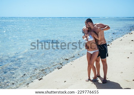 Couple on the beach of sea, love story. young couple having dream vacation on a beach