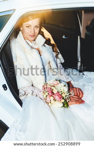 Portrait of a pretty bride in a car. close-up portrait of a pretty shy bride in a car window