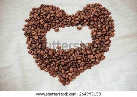 Heart from Coffe beans. Coffee beans in shape of heart. coffee beans isolated on white background. roasted coffee beans, can be used as a background.