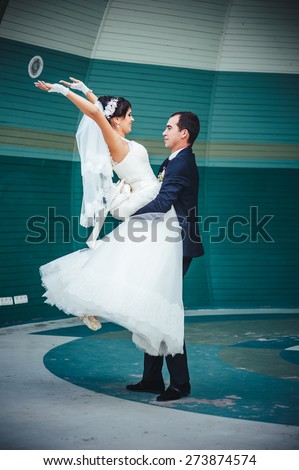 Bride and groom dancing in the park. Wedding dance in the open air. Dancers love flying.