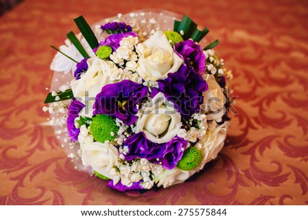 beautiful delicate bridal bouquet on the table. floral wedding theme