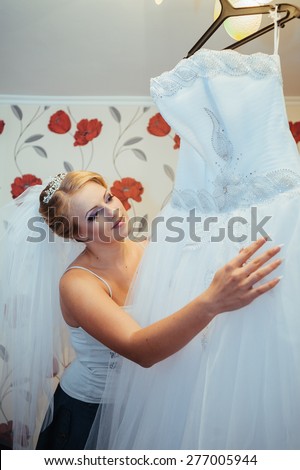 Beautiful caucasian bride getting ready for the wedding ceremony.