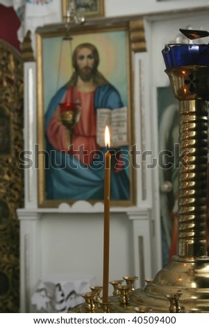 Candle in the background of the icons (focus on foreground)