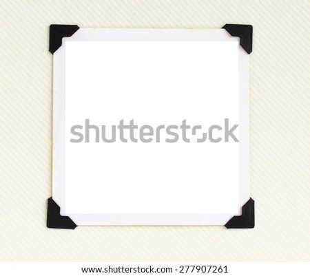 Square blank photo with black corners on retro photo album