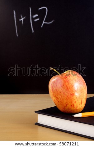 Back to school concept, apple on book