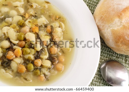 Vegetable soup served with crusty roll