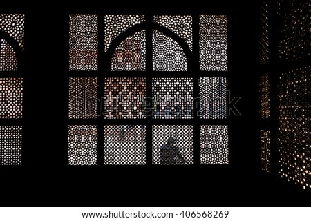 Patterned stone screen window of old Indian palace in Fatehpur Sikri, Uttar Pradesh, India.