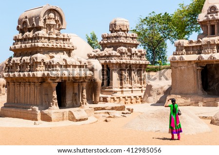 Tourist taking a picture at Pancha ratha temples in Mammallapuram, India
