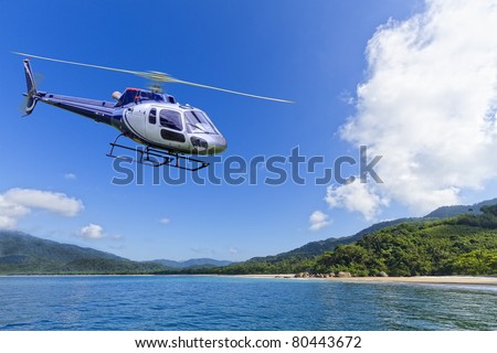 Helicopter flying over deserted Island in Angra dos Reis, Rio de Janeiro