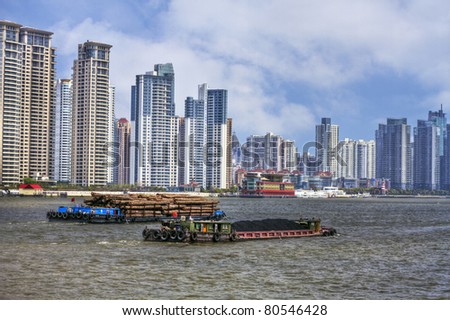 Shanghai - Coal and Timber Barges on the River Huangpu with Modern Buildings in the Background