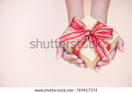 giving gift box in with hands On special days  for special person and copy space background