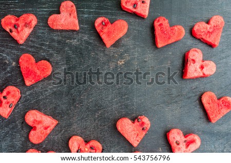 Water melon cut into heart shape. Space for text. Flat lay composition. love concept. Valentine's Day Concept