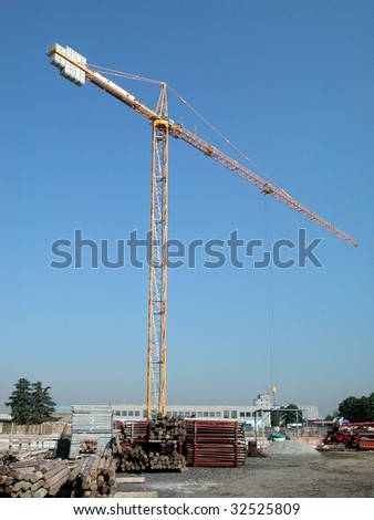 Crane in the yard of construction of a building