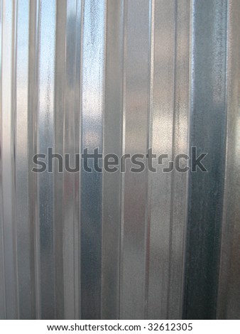 Galvanized zinc striped metal wall as a background