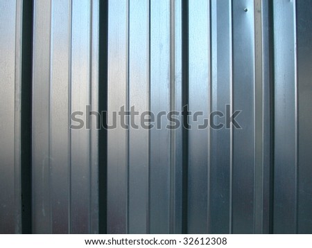 Galvanized zinc striped metal wall as a background