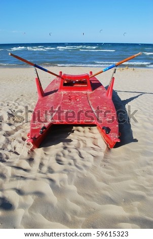Typical red rescue boat by the sea, Rimini, Italy