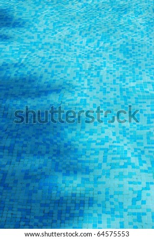 Clean blue water in a swimming pool as background