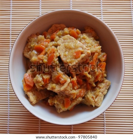 Stew tempeh with carrots, leeks and soy sauce in a bowl