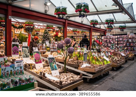 AMSTERDAM, HOLLAND - DECEMBER, 30: Amsterdam flower market (Bloemenmarkt). the world\'s only floating flower market and one of the main attractions of Amsterdam on 30 december 2012.