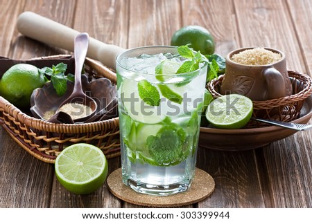 Mojito cocktail delicious summer drink on rustic wooden table