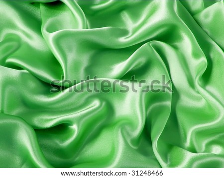 Smooth elegant green satin silk fabric as background