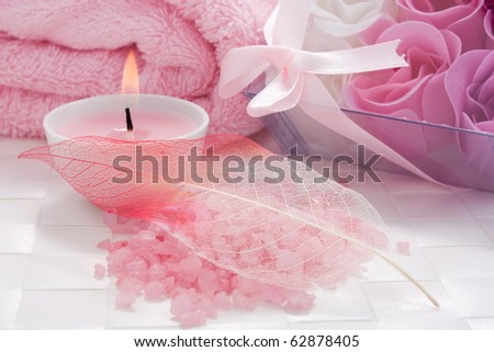 Aroma candle, bath salt and soap flowers of roses set for aromatherapy