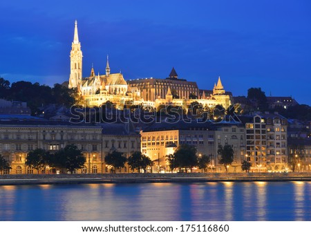 Danube river, Matthias Church and Fisherman\'s Bastion at night against a dark blue sky. Budapest, Hungary.