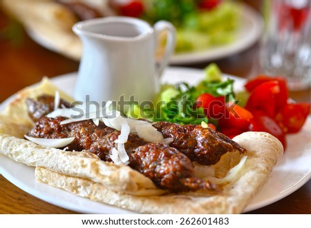 Kebab in pita bread with sauce and vegetables. Georgian cuisine. Georgia. Tbilisi.