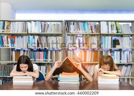 Young Student Group Reading Book Serious, Hard Exam, Quiz, Test Sleeping \
headache worry in Classroom Education Library University Knowledge center