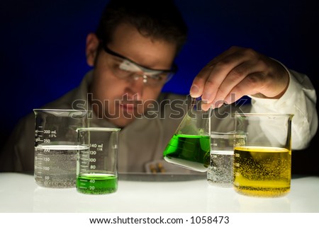 Man checking contents of glass beaker