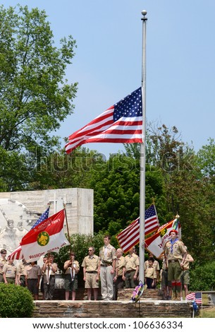 ANN ARBOR, MI - MAY 27: Boy scouts after placing the flag at half mast at the annual Memorial Day observance on May 27, 2012 at Arborcrest Memorial Park in Ann Arbor, MI