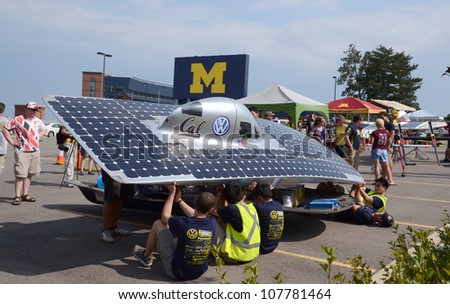 ANN ARBOR, MI - JULY 16: University of California Berkeley\'s solar car team members recharging their car at the American Solar Challenge stop July 16, 2012 in Ann Arbor, MI.