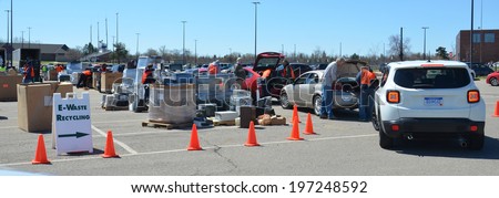 ANN ARBOR, MI - APRIL 26: Workers remove electronic equipment from cars at an electronic recycling event  in Ann Arbor, MI April 26, 2014.