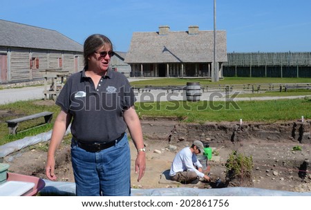 MACKINAW CITY, MI, USA- JUNE 22: Lynn Evans, Curator of Archaelogy for Mackinac State Historic Parks, explains a current dig at Fort Michilimackinac in Mackinaw City, MI on June 22, 2014.