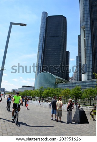 DETROIT, MI - JULY 6: People enjoy the day at the GM Plaza and Promenade, on the Detroit International Riverfront in Detroit, MI on July 6, 2014.