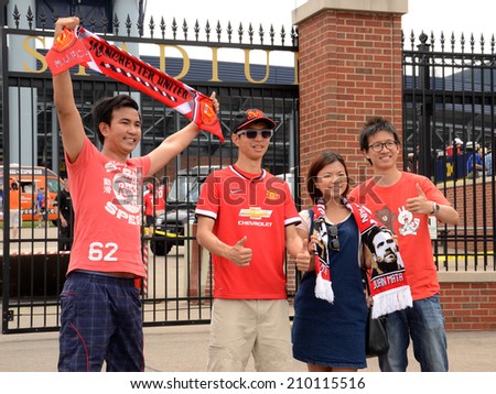 ANN ARBOR, MI - AUGUST 2:  Manchester United fans get their pictures taken outside Michigan Stadium at the International Champions Cup game on August 2, 2014 in Ann Arbor, MI.