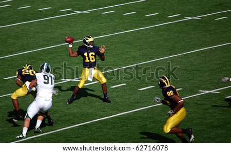 ANN ARBOR, MI - OCTOBER 09: Denard Robinson throws a pass during the Michigan vs. Michigan State football game October 9, 2010 in Ann Arbor, MI. Michigan lost the game 34-17.