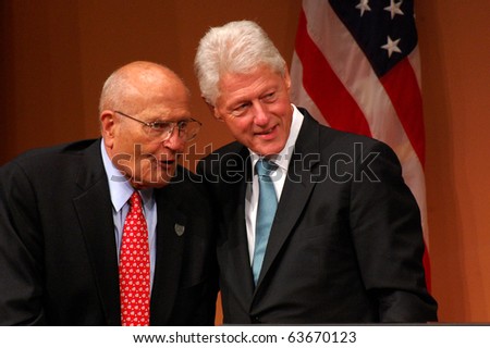 ANN ARBOR, MI - OCTOBER 24: Former President Bill Clinton poses with Congressman John Dingell of Michigan after speaking at a \