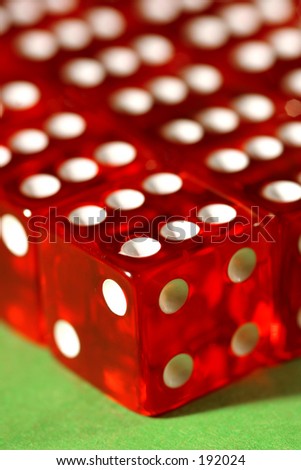 Macro shot of dices lined up on a green table