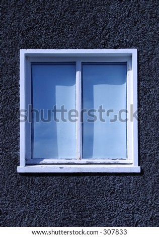 Single apartment window with blinds