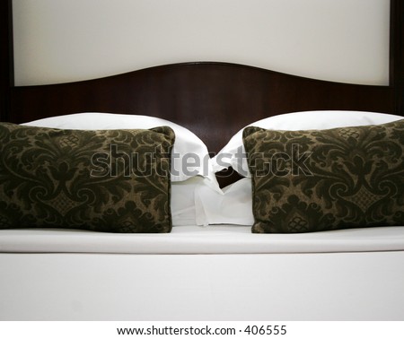 Hotel bed with fresh sheets