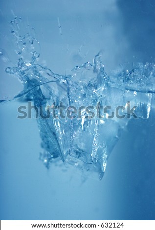 Icecubes falling in water with a big splash
