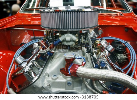 Highly customized car engine in a rebuilt muscle car - all copyright materials removed