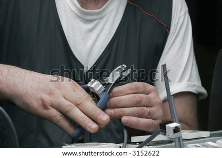 Electrician at work setting up a computer network