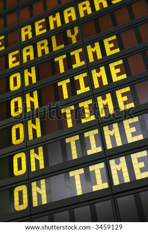 Airport board showing arrivals and departures on time