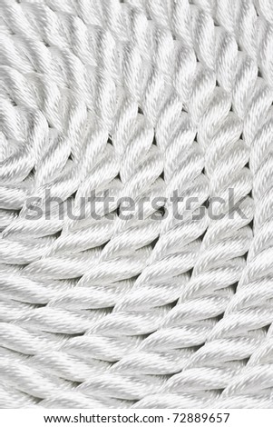 Close-up of a white rope curled up and filling the frame