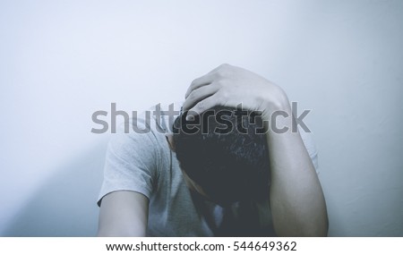 The man worried in black and white background,soft focus