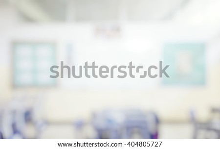 Blur abstract background of kindergarten classroom. Blurred image of empty elementary room. Blurry view of primary class without student  or teacher with chairs and tables