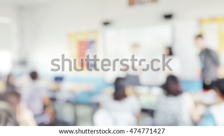 Blur abstract background teacher in front of classroom for meet the parent day. Blurry teachers teaching in school. Defocus open house day at campus for kindergarten students.